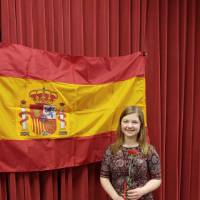 Megan Kruskie posing in front of Spanish flag